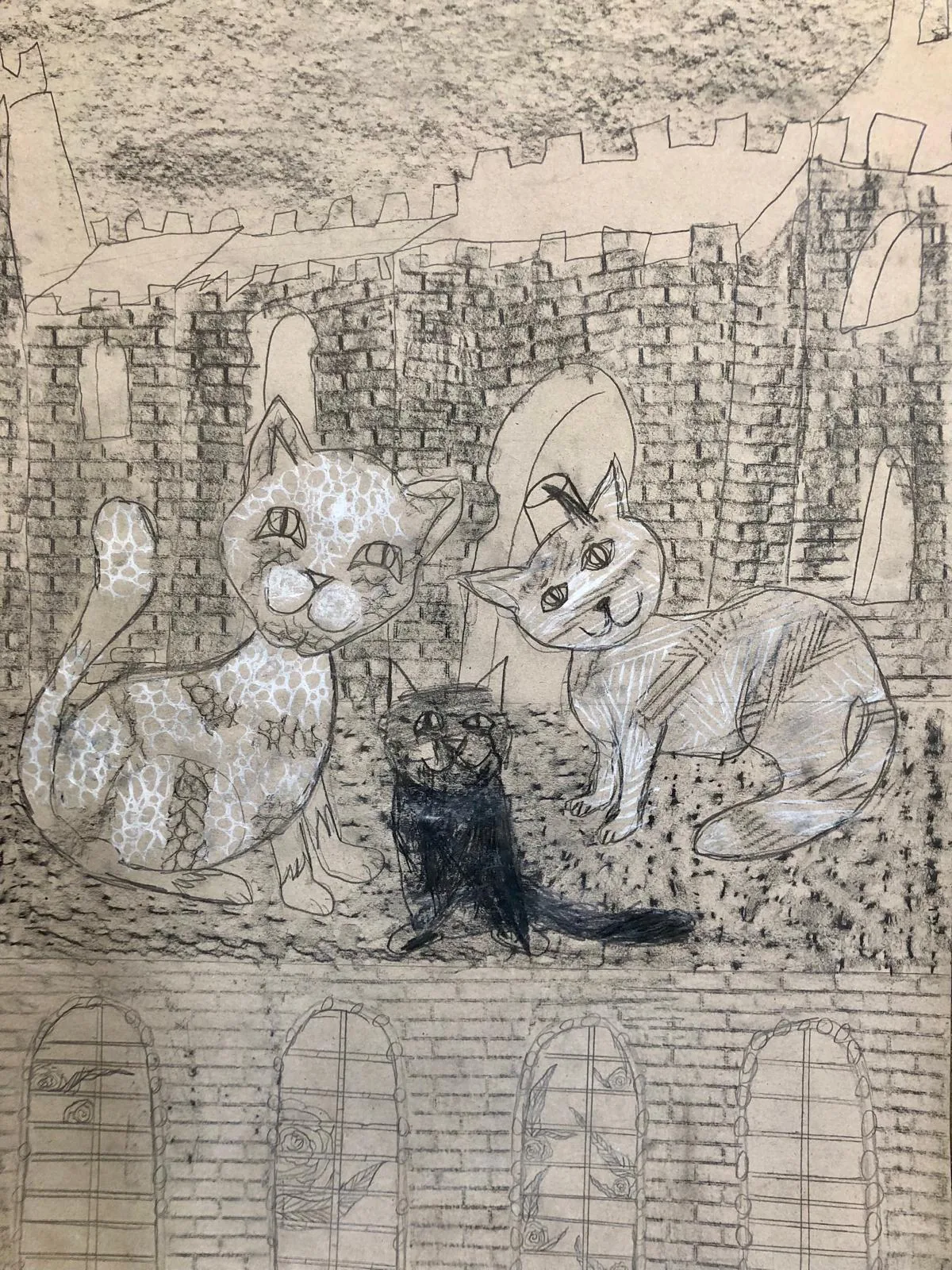 Schülerarbeit von Yury Codial, 11 Jahre, mit drei Katzen vor einer Burgmauer